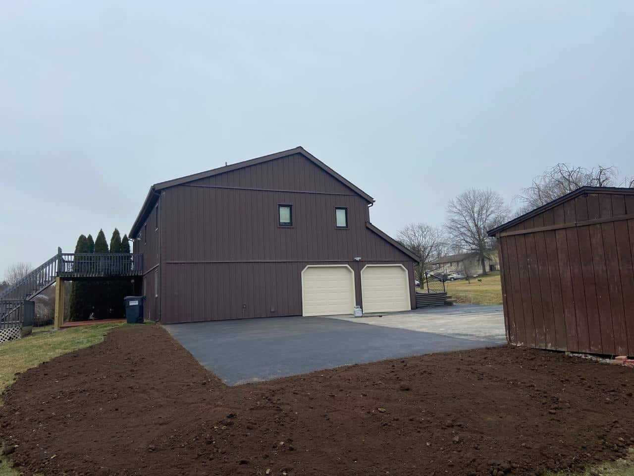 An asphalt driveway graded to shed water and avoid drainage problems in Berks County, PA