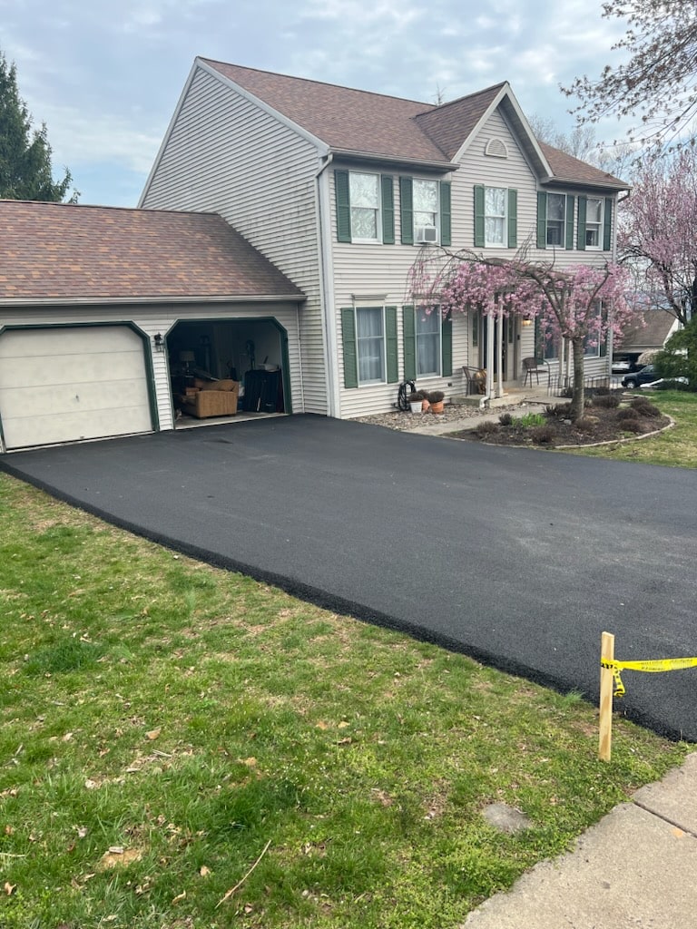 Freshly sealcoated asphalt driveway protecting the surface