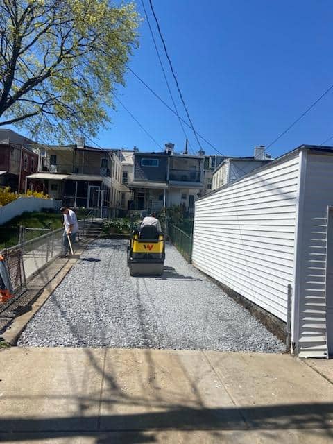 Compacting a crushed stone base for a driveway in Berks County, PA