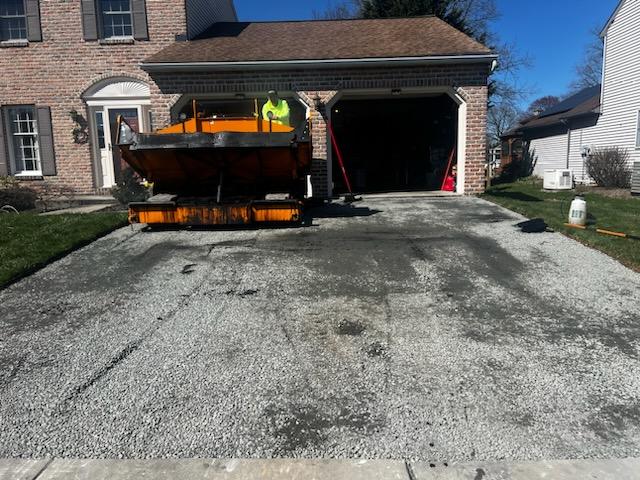Old driveway removed and new stone base laid before new blacktop